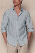 Man wearing a tailored Abilo Striped Shirt in khaki/ecru with an open collar, chest pocket, and rolled sleeves.