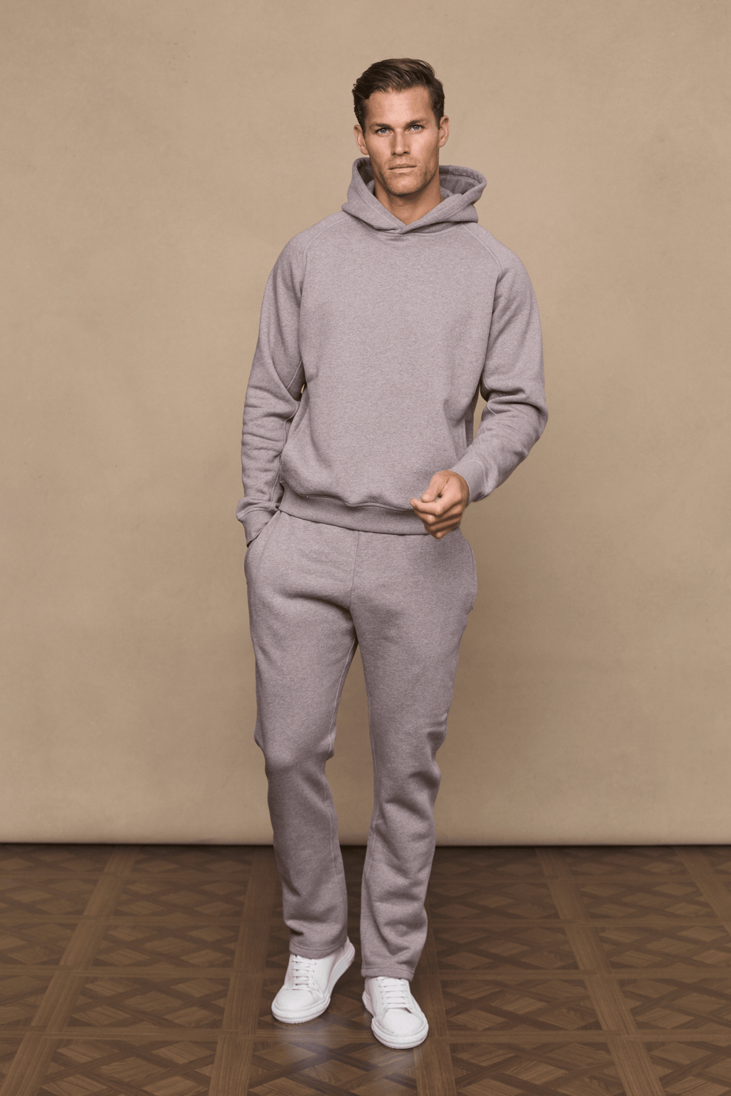 Man in brown marl Axel straight leg jogger and matching hoodie, white sneakers.