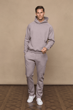 Man in brown marl Axel straight leg jogger and matching hoodie, white sneakers.