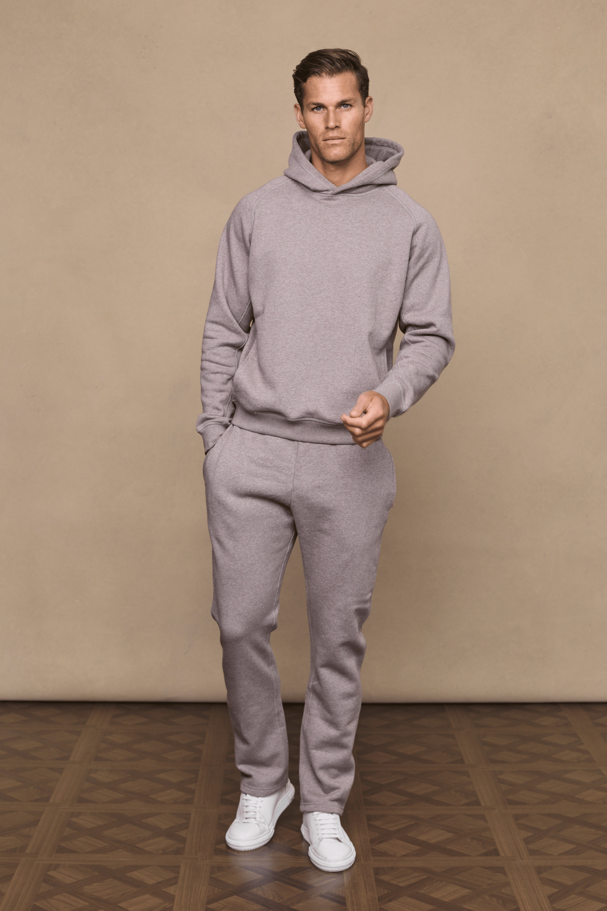 Man in brown marl Axel straight leg jogger and matching hoodie, white sneakers.