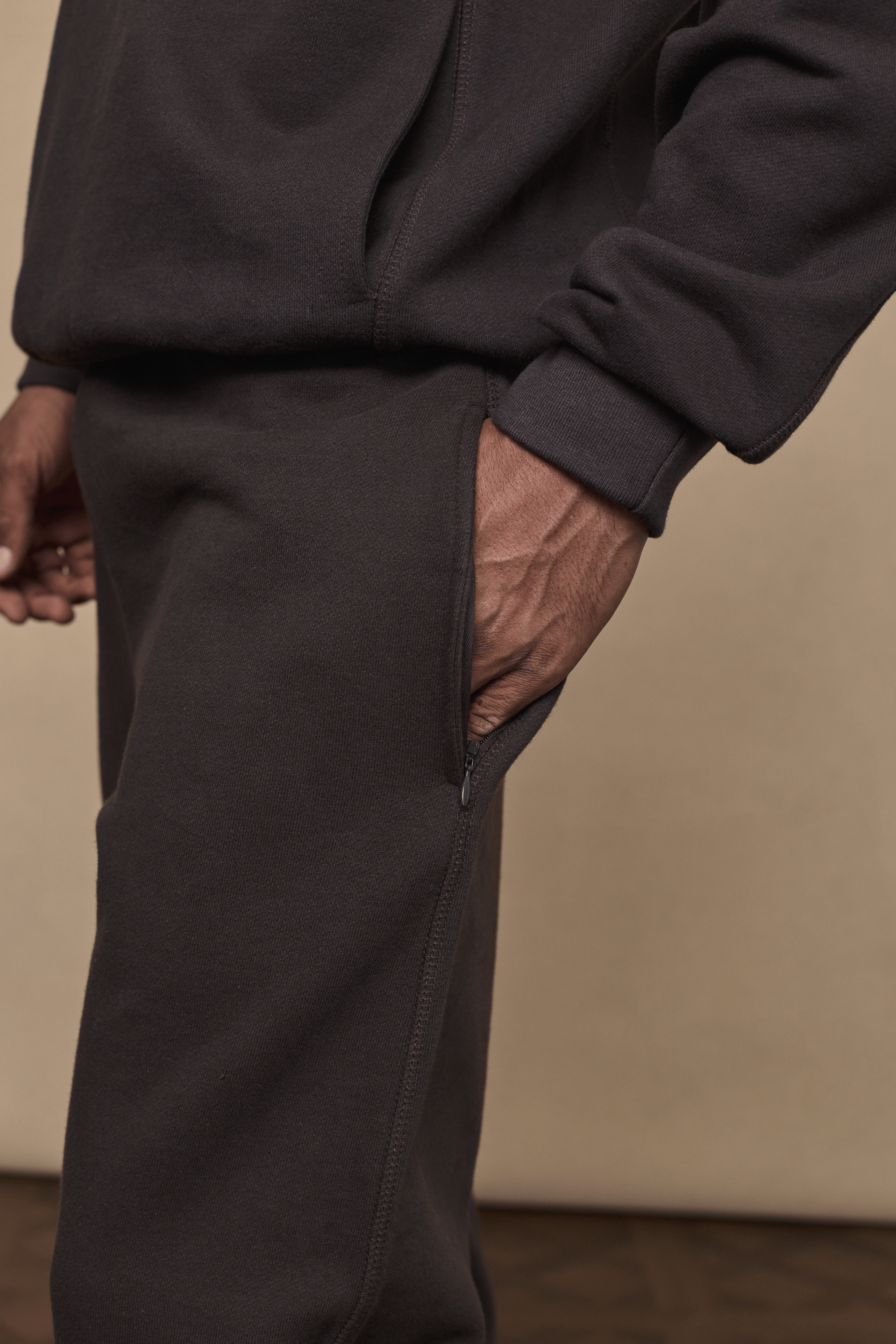 Dark brown Axel straight leg jogger with a zippered side pocket and matching hoodie.