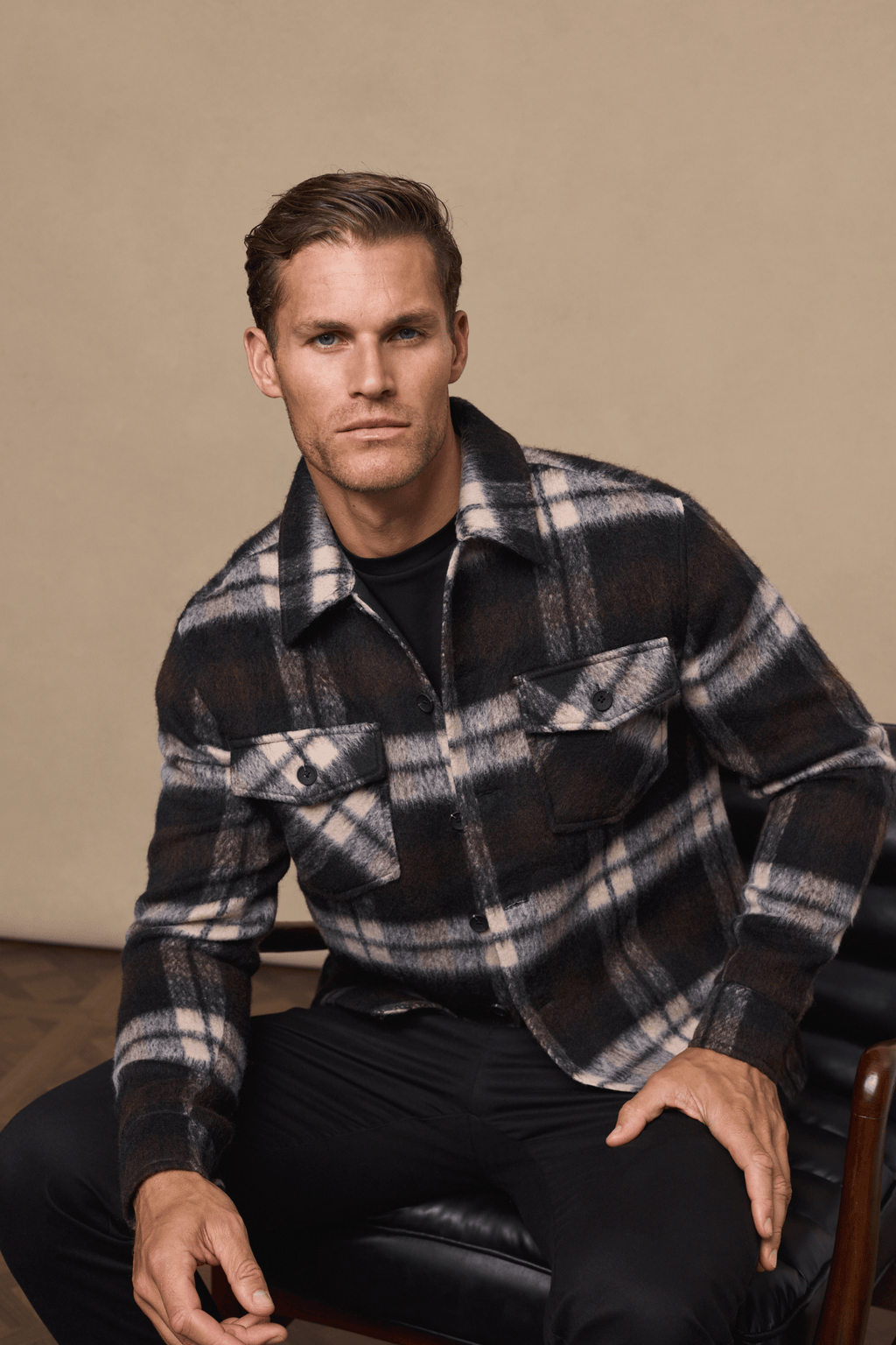 Man in a brown/beige brushed wool checked Caldera jacket with twin chest pockets.