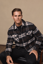 Man in a brown/beige brushed wool checked Caldera jacket with twin chest pockets.