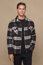 Man wearing a Caldera brushed wool checked jacket in brown/beige with a point collar and chest pockets.