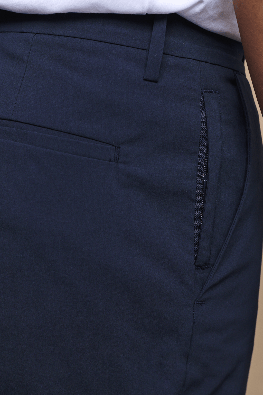 Dark navy Enzo Hybrid Trouser with a concealed zip pocket and belt loops, made from lightweight 4-way stretch fabric.