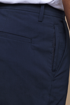 Dark navy Enzo Hybrid Trouser with a concealed zip pocket and belt loops, made from lightweight 4-way stretch fabric.