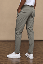 Man wearing dark olive Enzo Hybrid Trousers made from lightweight 4-way stretch fabric, with side pockets and belt loops.