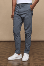 Man wearing slate Enzo Hybrid Trousers made from lightweight 4-way stretch fabric with side pockets.