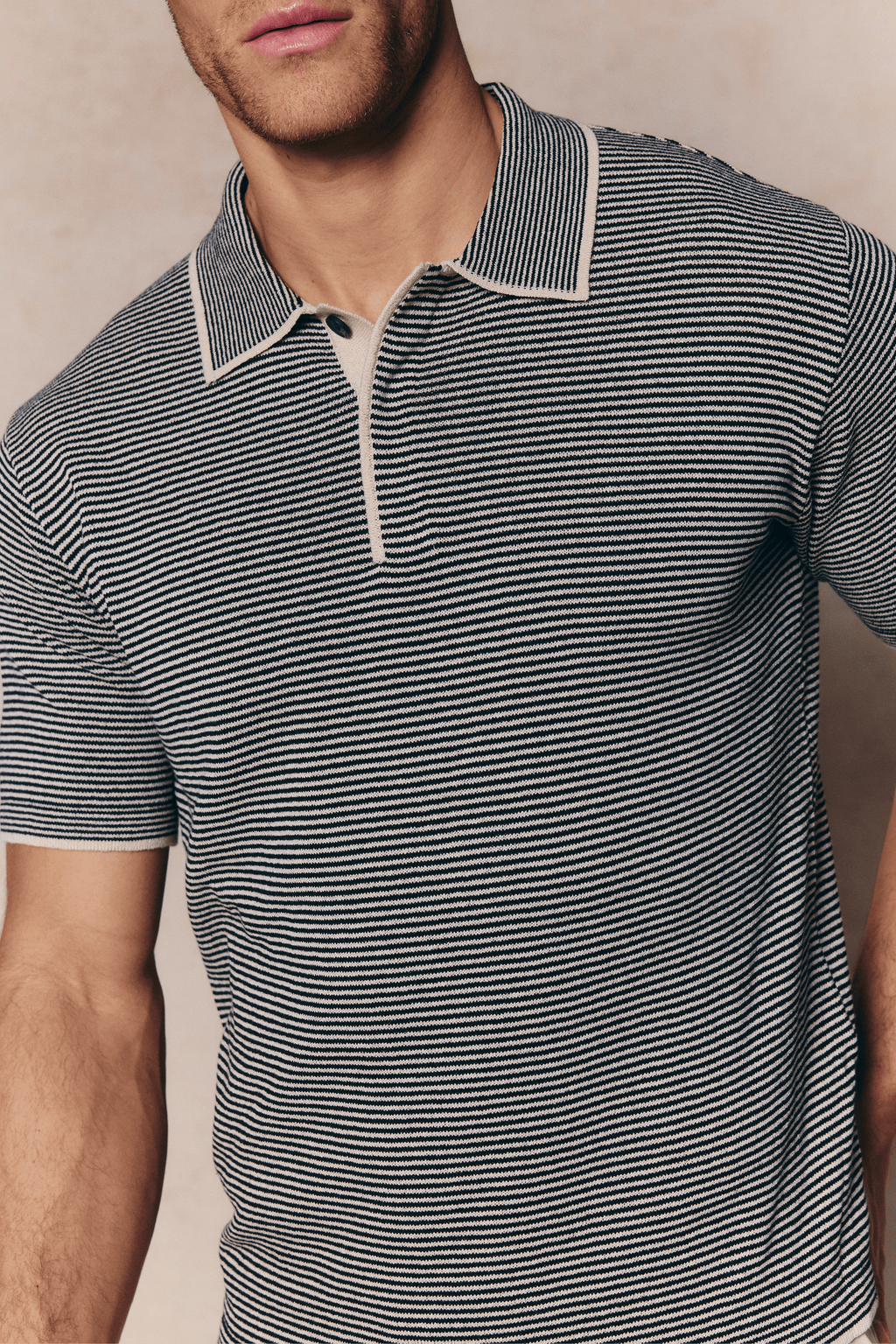 Men's Felipe beige/black striped linen blend polo with concealed half placket and contrast hems.