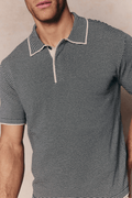 Men's Felipe beige/black striped linen blend polo with concealed half placket and contrast hems.