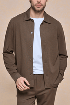 Man wearing a brown Geneva Textured Overshirt over a white tee, with matching brown trousers.