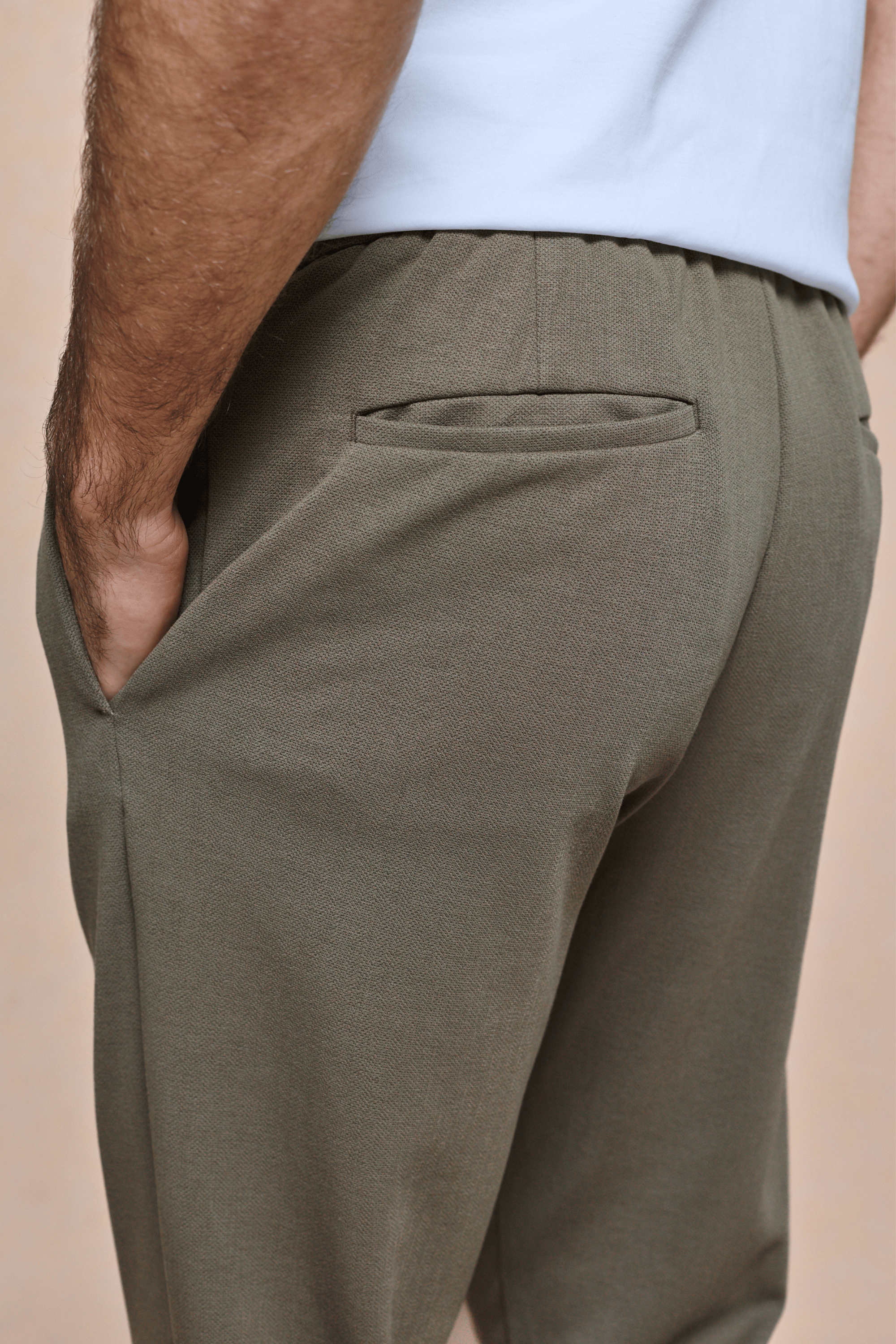 Khaki Geneva Textured Tapered Trouser with elasticated waistband, side entry pockets, and back pocket.