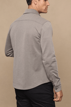 Man wearing a beige/brown textured Jacques Overshirt with pearlescent buttons and a classic collar.