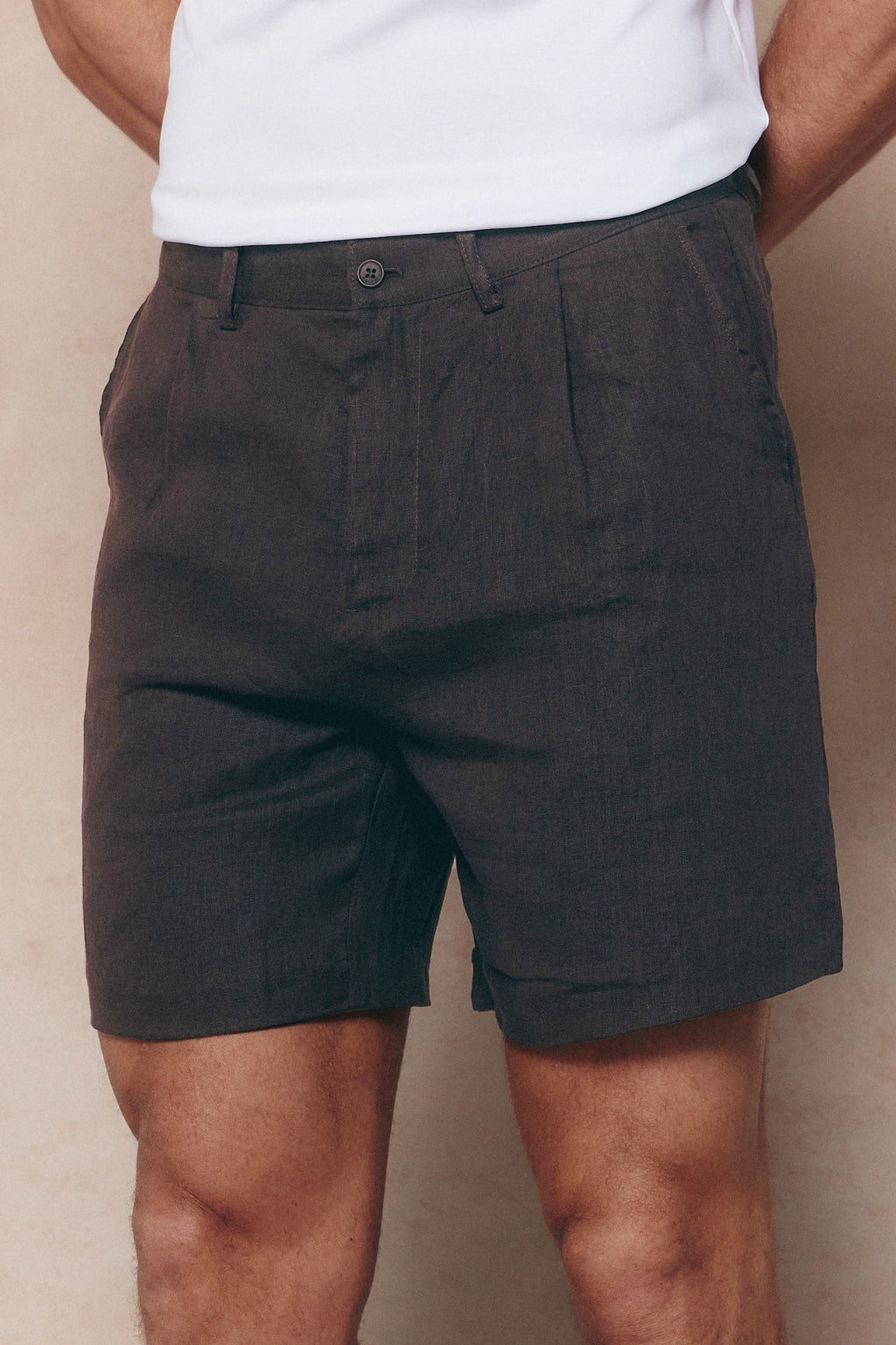 Brown Javier pleated waistband linen shorts with belt loops and side pockets.