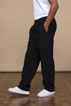 Black Julien Relaxed Panelled Trousers with straight fit, subtle top-stitched panels, and side pockets.