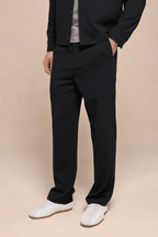 Black Julien Relaxed Panelled Trousers with straight fit, subtle top-stitched panels, and side pockets.