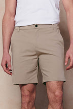 Men's beige Luiz Hybrid Short with tailored chino look, four-way stretch, and six-pocket design.