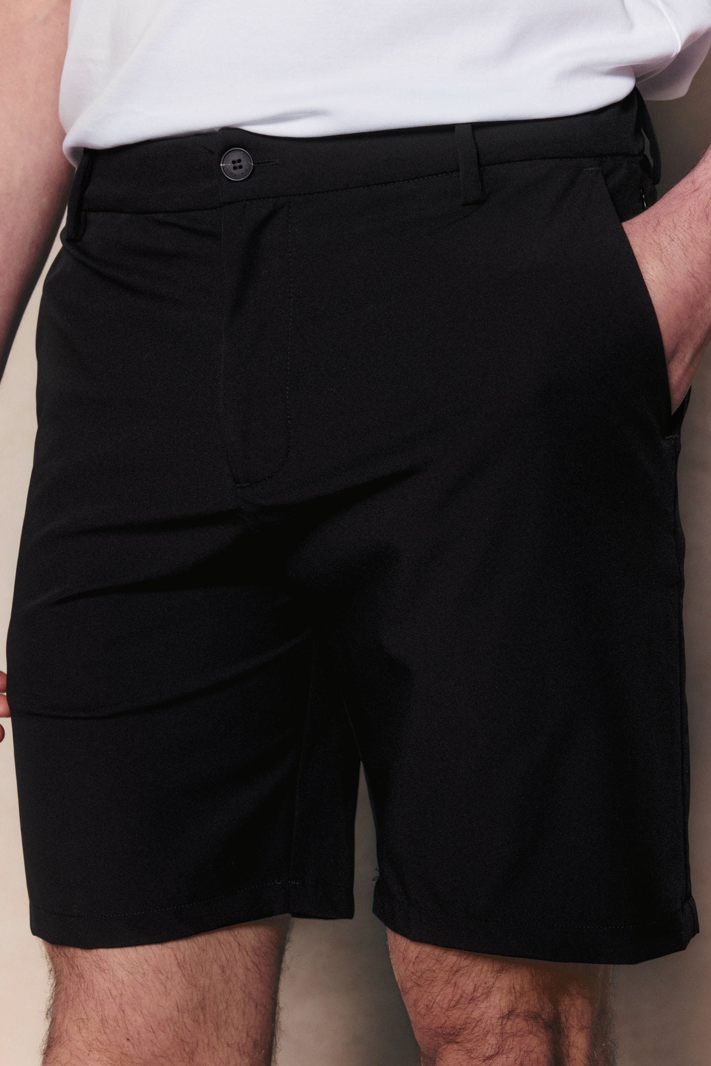 Black Luiz Hybrid Short with tailored finish, button closure, and concealed zip pockets.