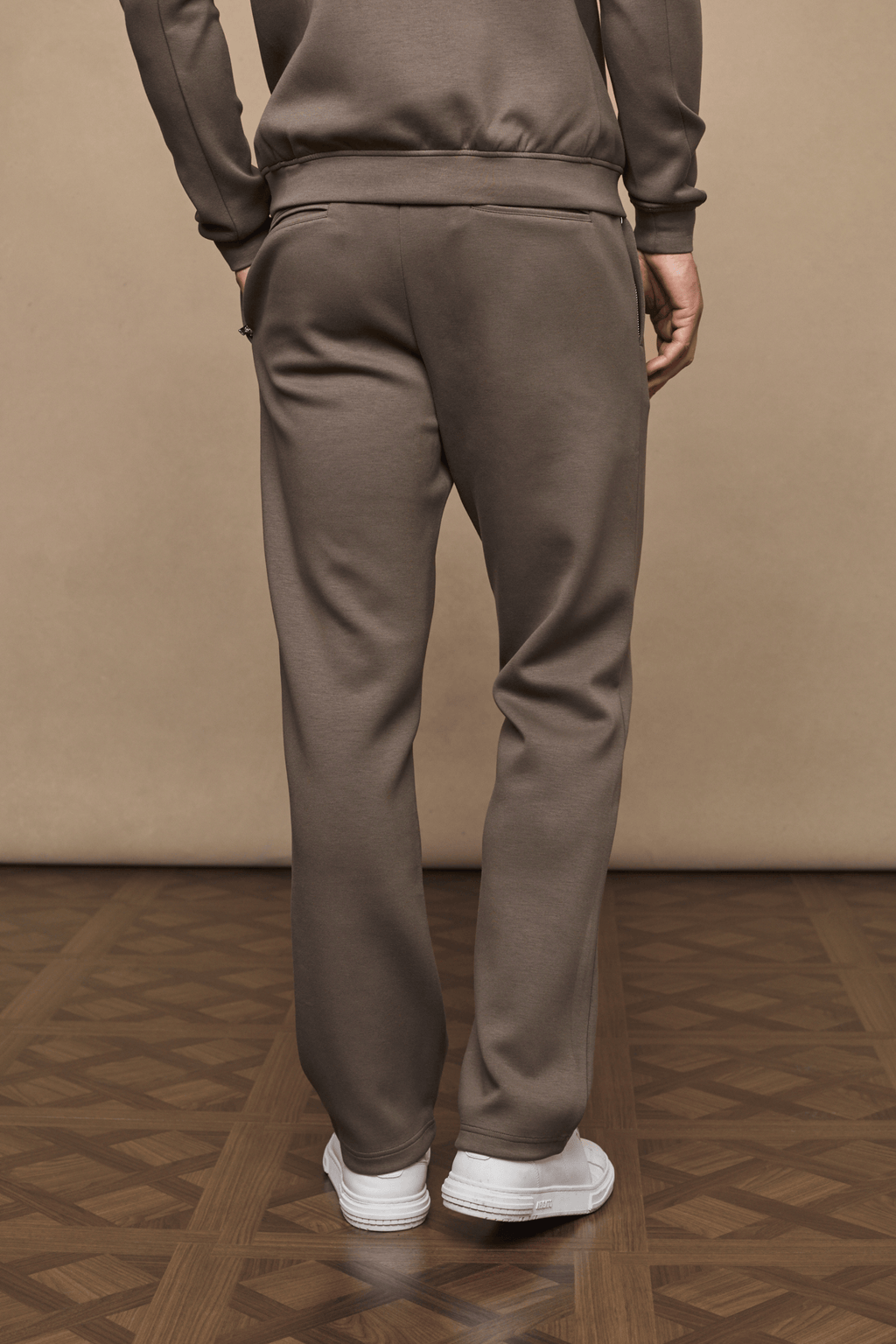 Back view of Luxe Straight Leg Jogger in Burnt Olive, showing straight leg, side pockets, and soft fabric.