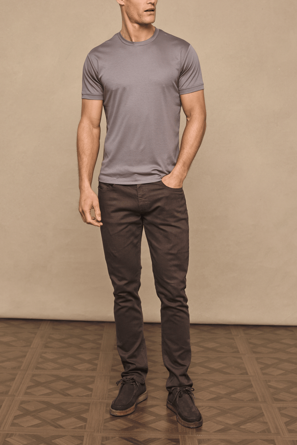 Man wearing dark brown Marco Jean and a grey t-shirt, showcasing the straight-slim fit.