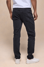 Men's Marco Washed Jean in light washed black denim, straight-slim fit, with back pockets and leather patch.