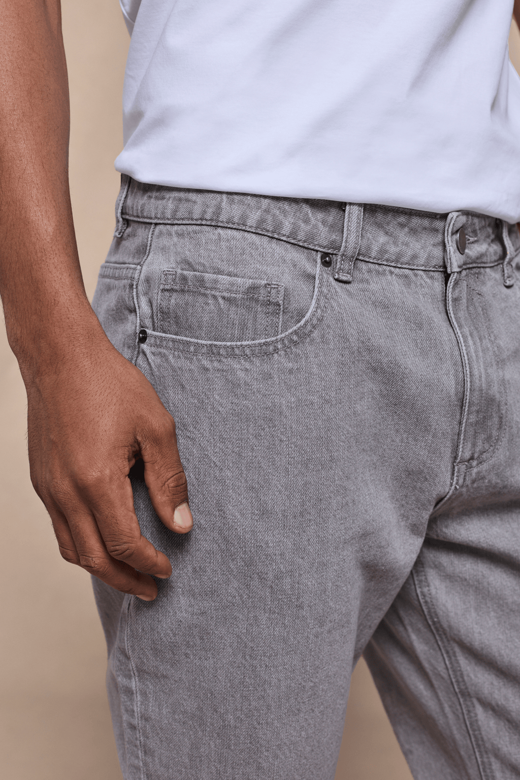 Close-up of Marco Washed Jean in Stone Grey, showing the straight-slim fit, cotton-elastane denim, and front pocket.