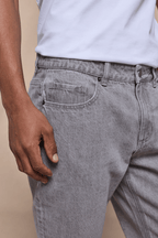 Close-up of Marco Washed Jean in Stone Grey, showing the straight-slim fit, cotton-elastane denim, and front pocket.