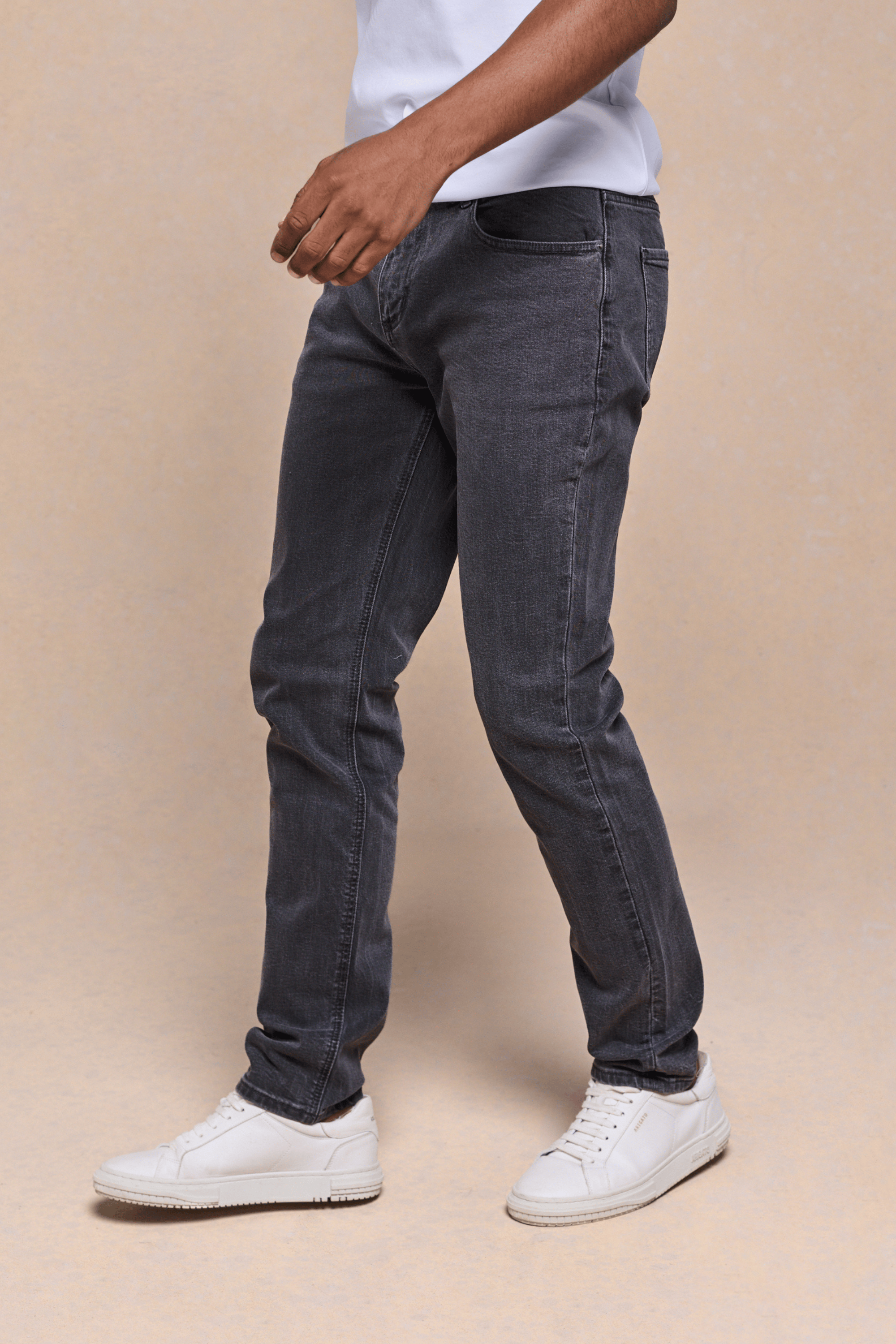 Man wearing Marco Washed Jean in Washed Grey, a straight-slim fit denim with branded hardware and leather patch.