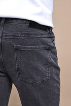 Men's Marco Washed Grey straight-slim jeans, showcasing back pocket, leather patch, and branded hardware.