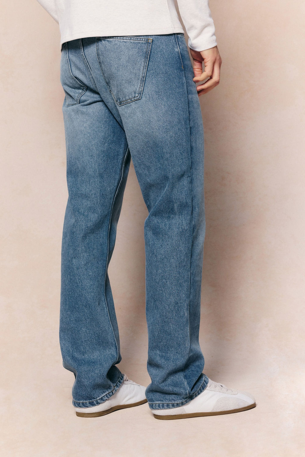 Mason relaxed fit midwash indigo jeans made from 100% cotton denim with a tan leather back patch.