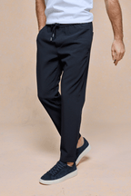 Mateo Tapered Trouser in dark navy, featuring an elasticated drawcord waistband and a clean, tapered silhouette.