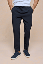 Mateo Tapered Trouser in dark navy, featuring an elasticated drawcord waistband and side pockets.