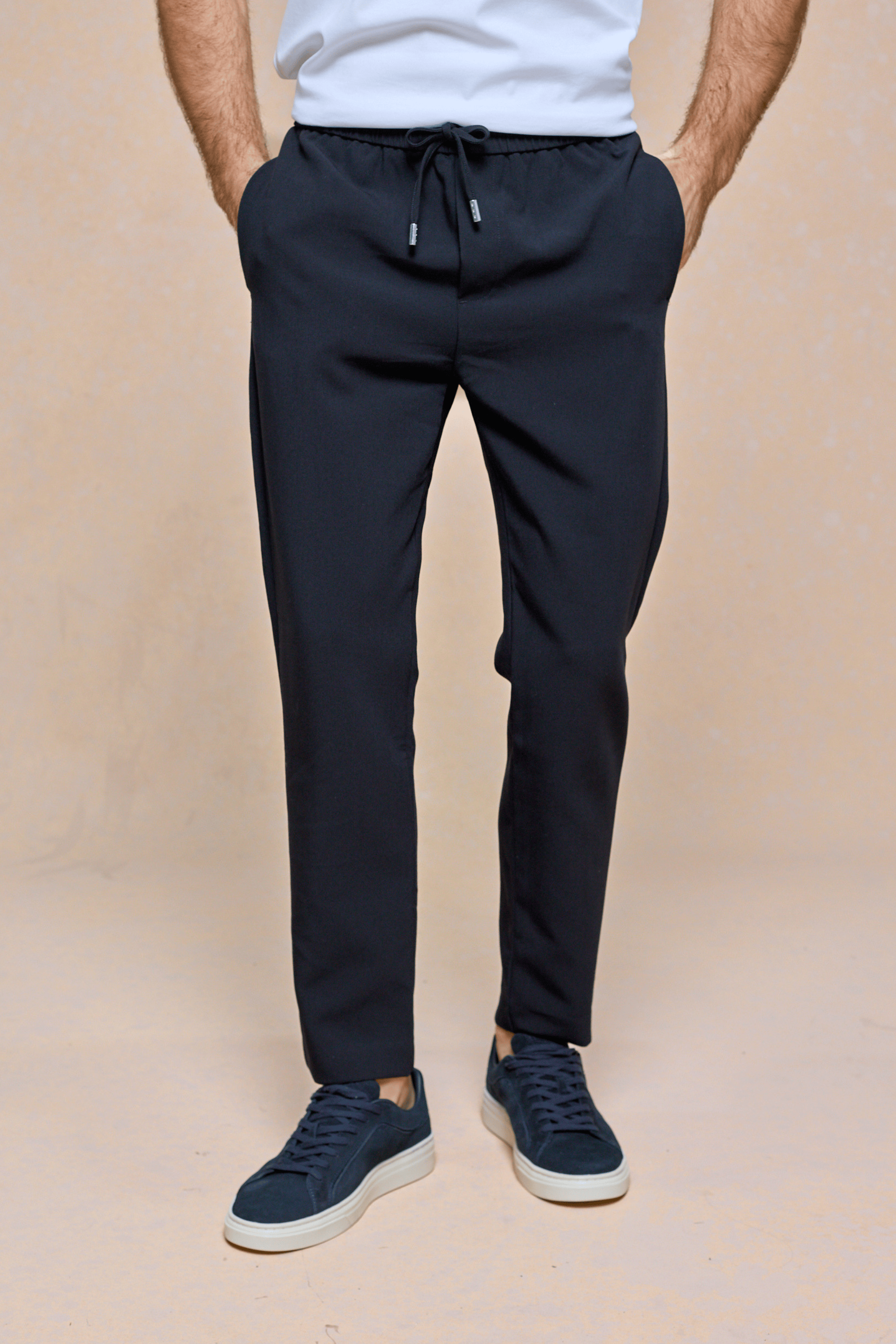 Mateo Tapered Trouser in dark navy, featuring an elasticated drawcord waistband and side pockets.