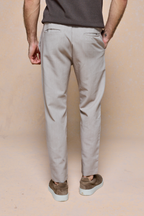 Mateo Tapered Trouser in Oatmeal Marl, shown from behind, featuring a clean, tapered silhouette and elasticated drawcord waistband.