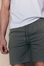 Khaki Milo Cargo Tech Shorts with elasticated waistband, drawcords, and side patch pockets.