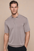 Man wearing a tailored Pablo Half Placket Short Sleeve Knitted Polo in sand with ribbed sleeves and hem.