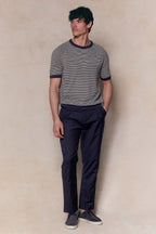 Man wearing a Rafael Linen Striped Crew Neck T-Shirt in navy/beige with navy trousers and shoes.