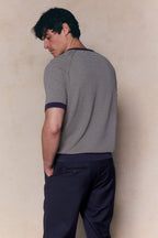 Man wearing a Rafael Linen Striped Crew Neck T-Shirt in navy/beige with navy trim and navy pants.