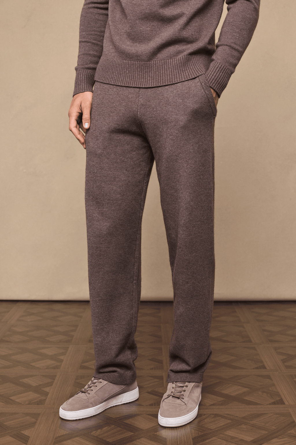 Men's Rowan Knitted Trouser in Brown Marl, featuring soft knit fabric, side pockets, and relaxed fit.