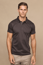 Man wearing a brown Santi mercerised cotton polo shirt with a concealed button placket.
