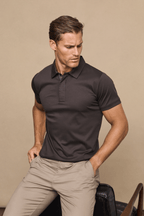 Man wearing a brown Santi mercerised cotton polo shirt with a concealed button placket and beige trousers.