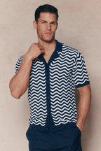Man in Serenita Ecru/Navy knitted shirt with wavy pattern, open collar, and full button placket.