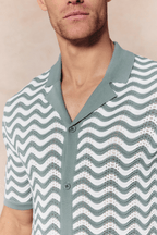 Serenita Knitted Shirt in sage/white with a wave pattern, button-through front, and open collar.