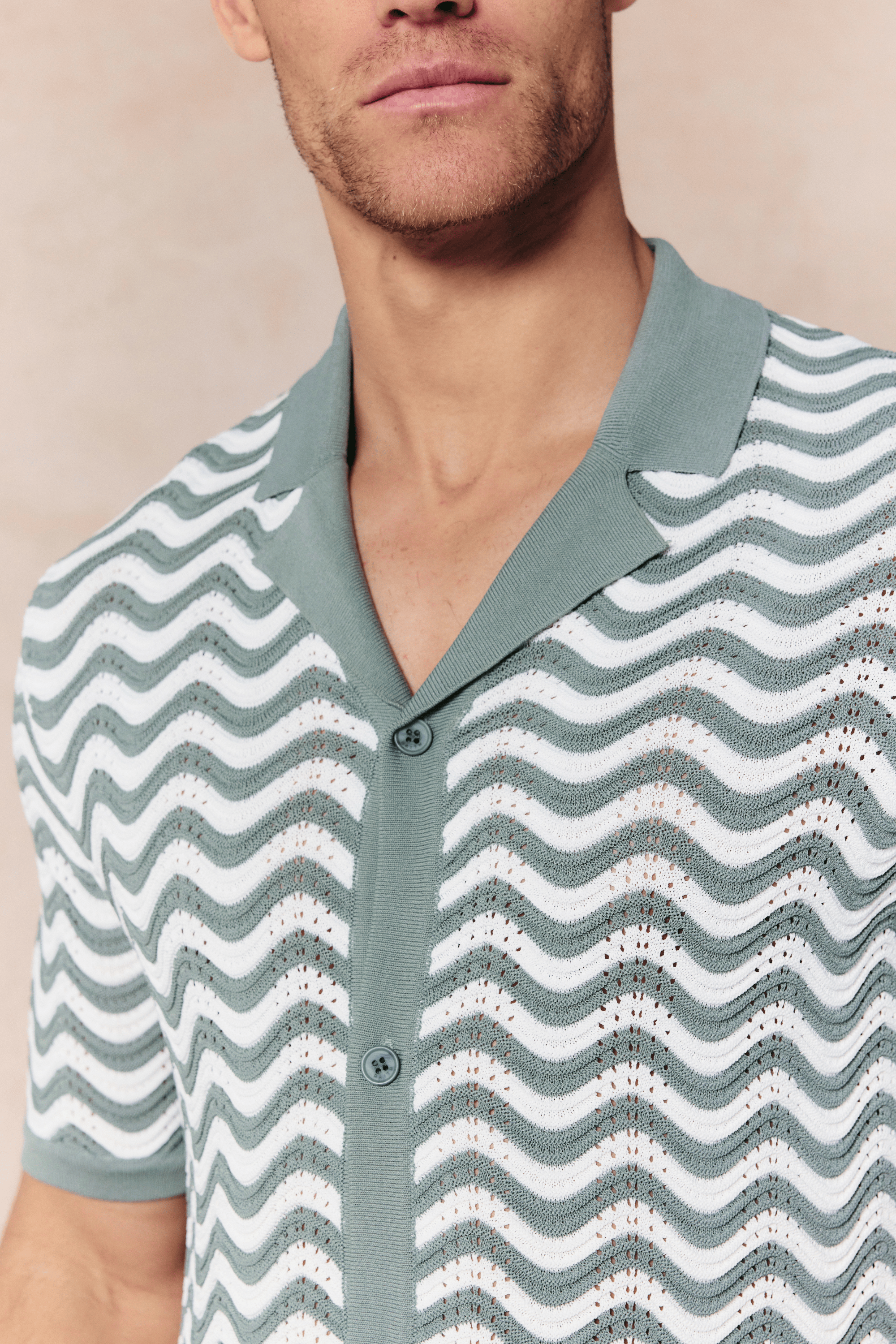 Serenita Knitted Shirt in sage/white with a wave pattern, button-through front, and open collar.