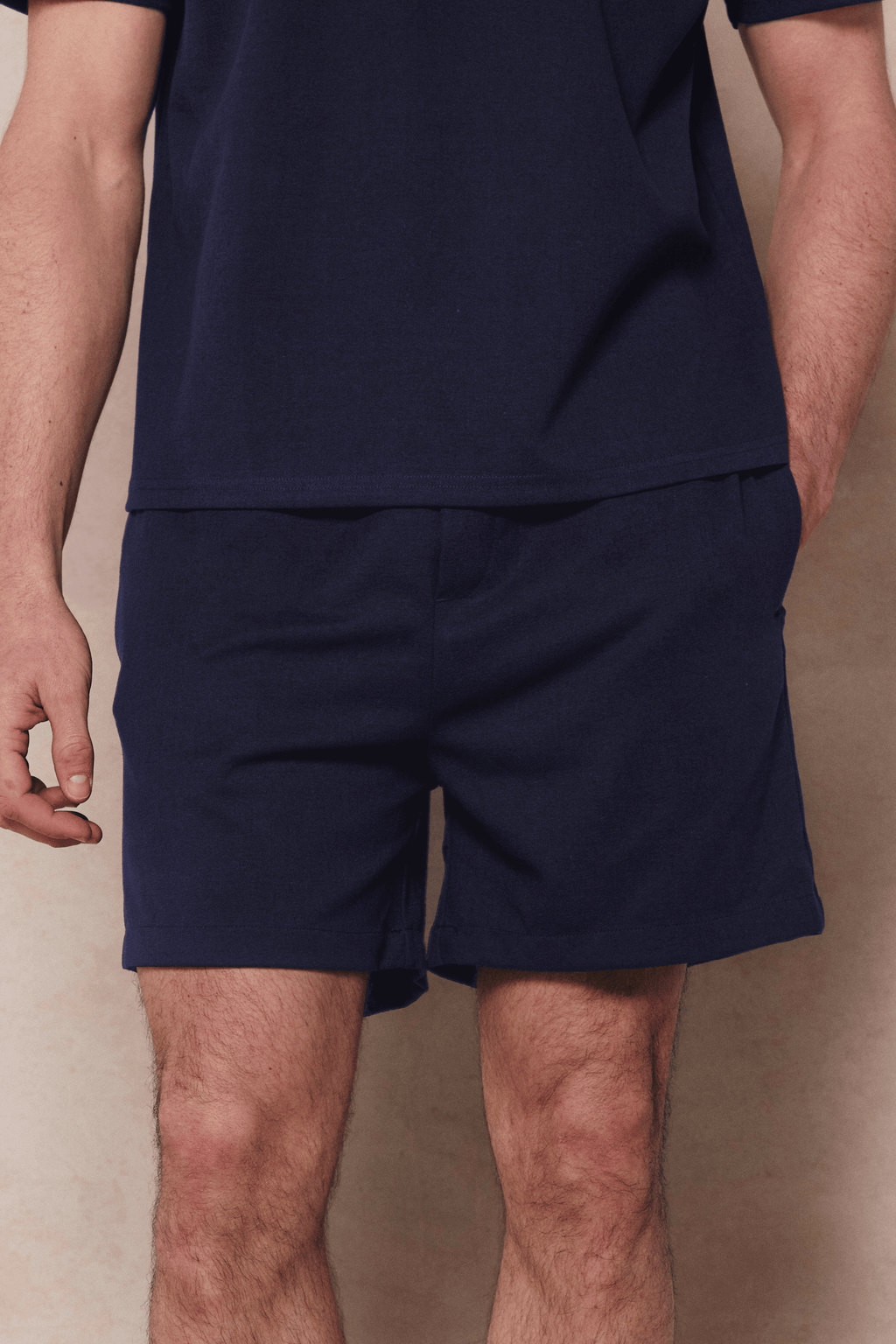 Navy Tomas elasticated waist shorts with drawcords, relaxed fit, and crinkled texture fabric.