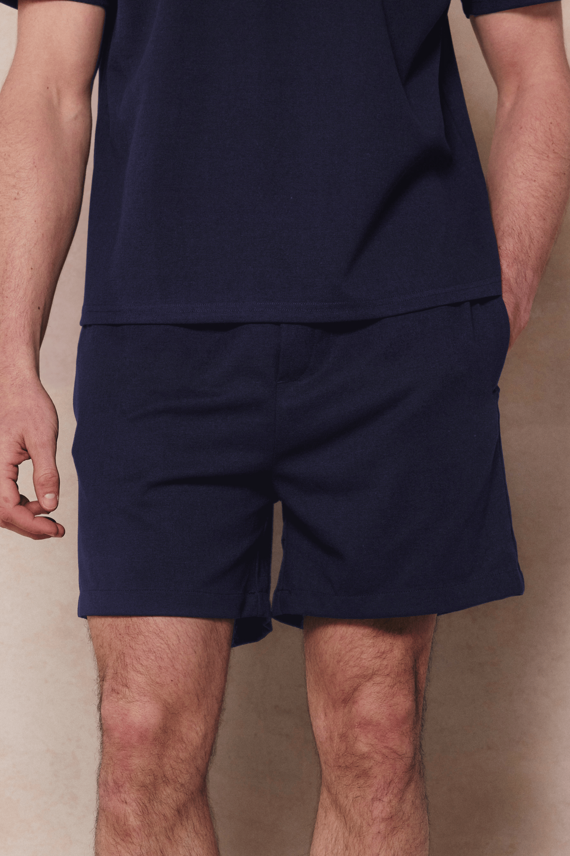 Navy Tomas elasticated waist shorts with drawcords, relaxed fit, and crinkled texture fabric.