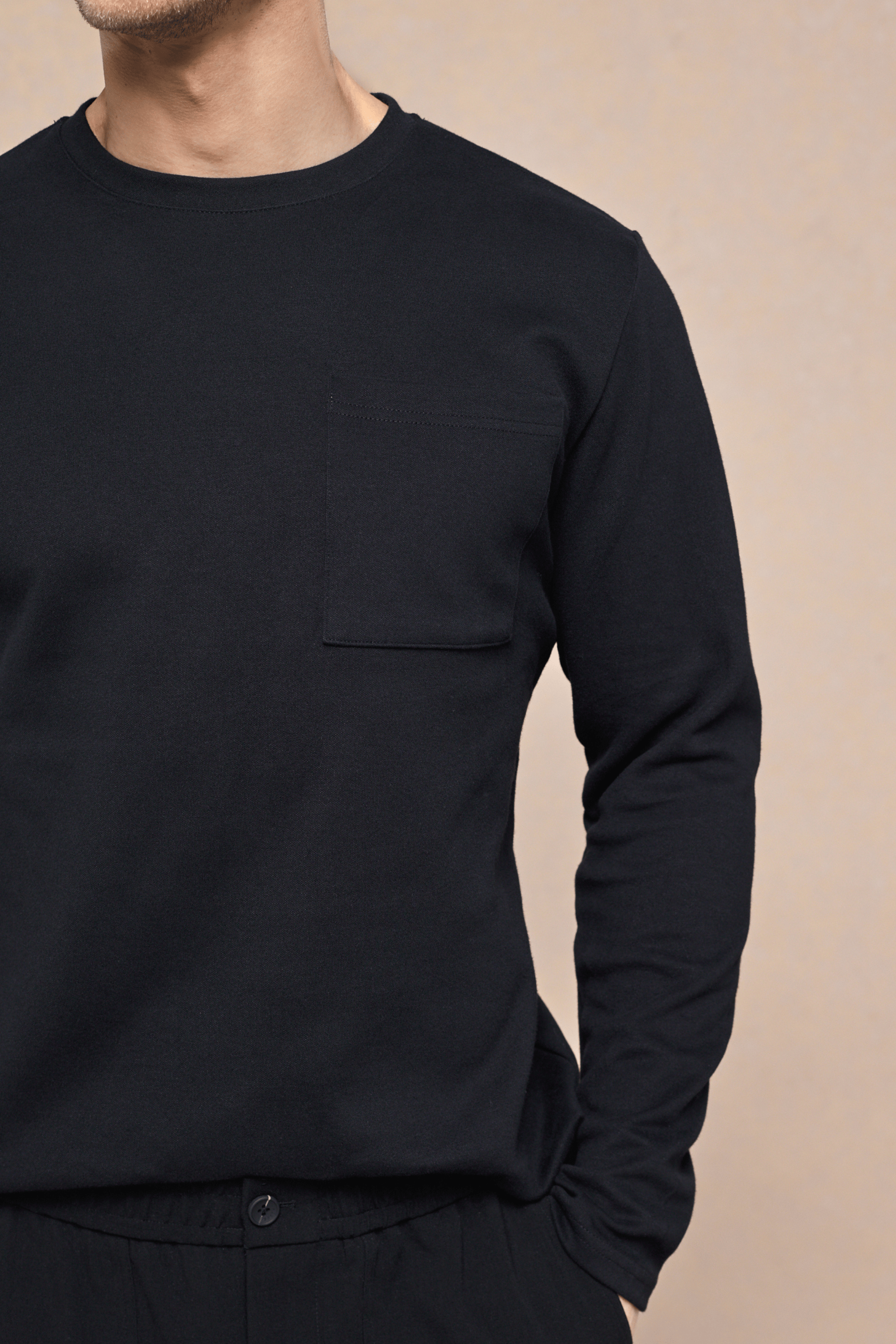 Black Tyler long sleeve crew neck t-shirt with a chest pocket, made from heavyweight cotton-rich fabric.
