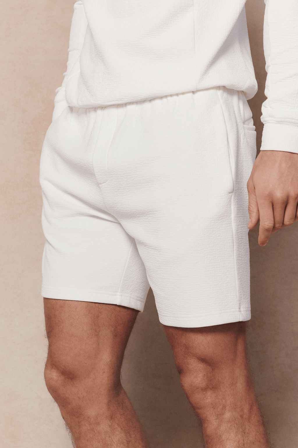 Ivory Zarco Crinkled Jersey Short with textured finish, relaxed fit, and side pockets on a model.