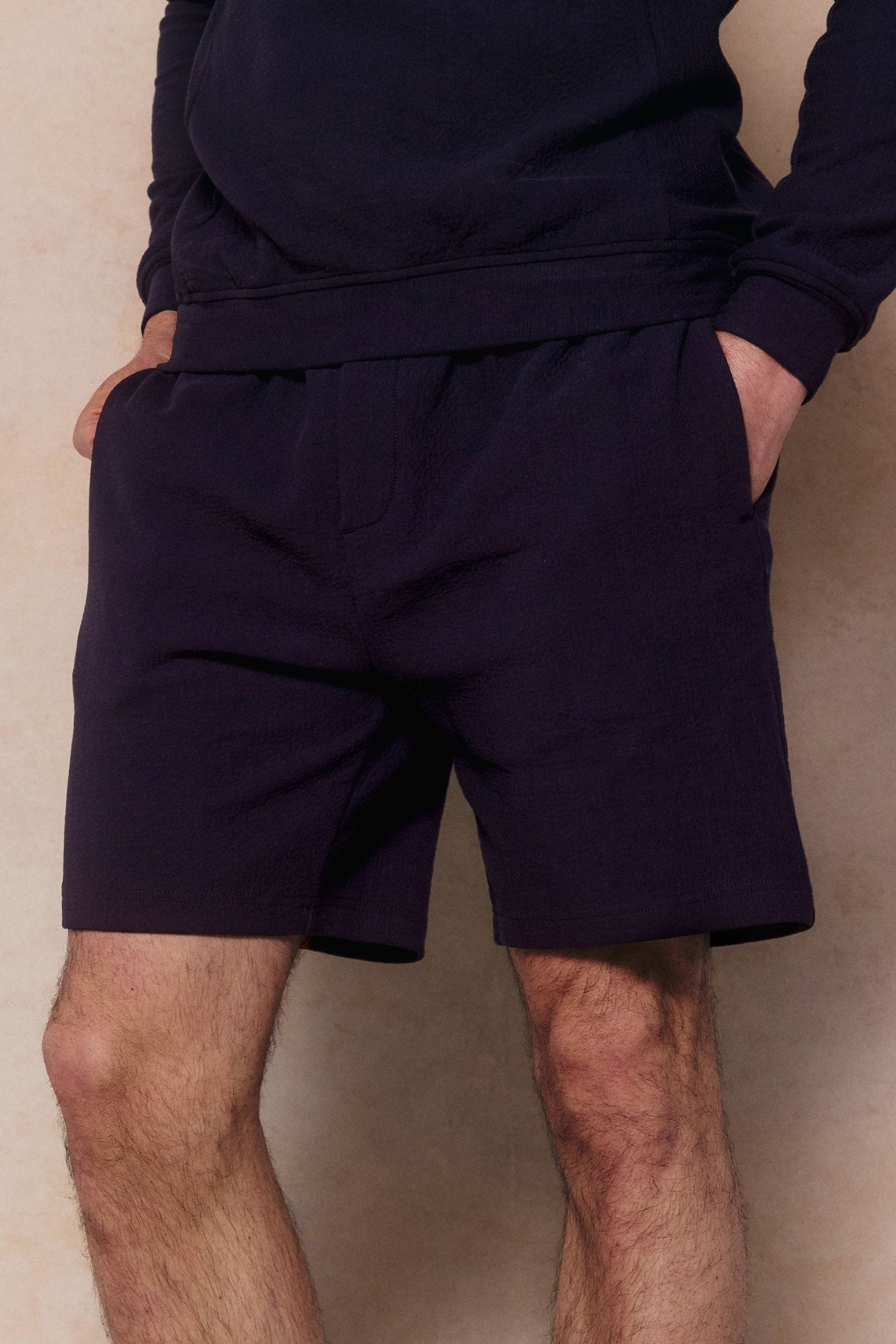 Navy Zarco Crinkled Jersey Short on a person, showing the textured fabric and relaxed fit.