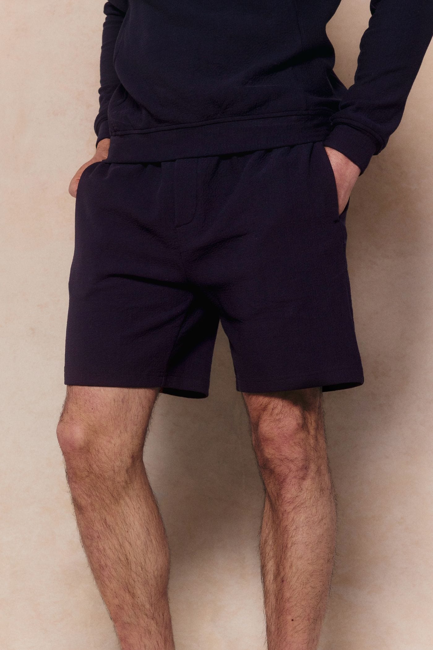 Zarco Navy Crinkled Jersey Short with relaxed fit, textured finish, and stretch fabric.